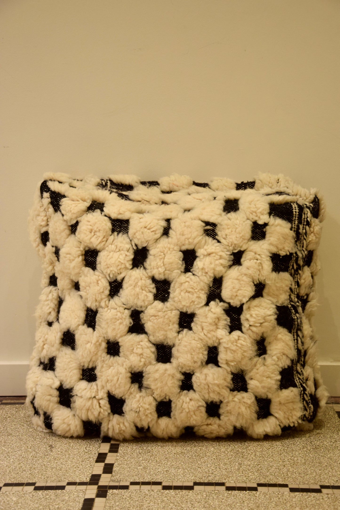 Fluffy black and white pouf